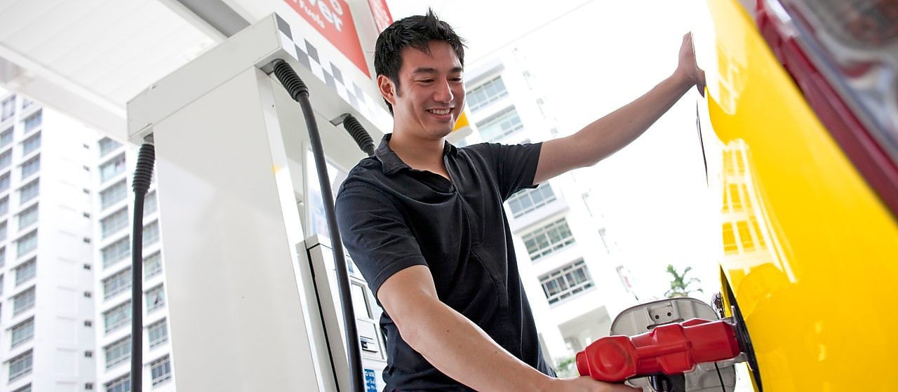 Man refueling his car at a petrol pump