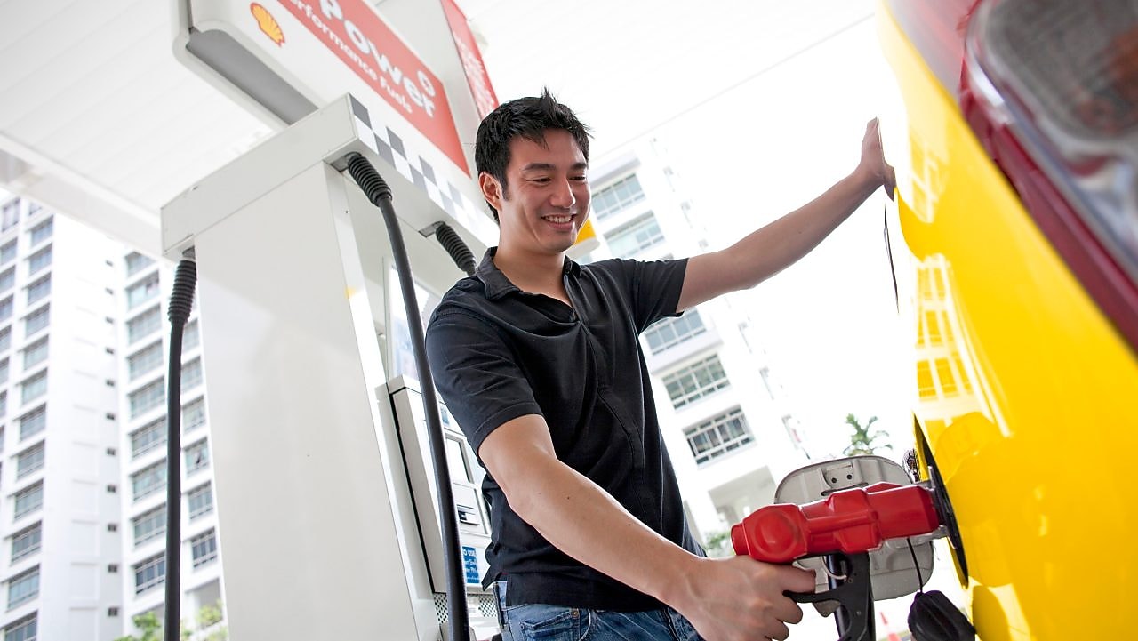 Man refueling his car at a petrol pump